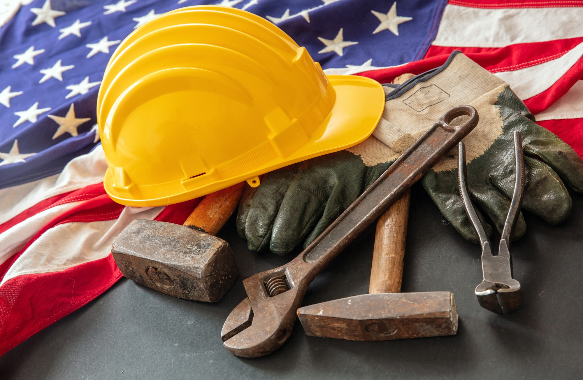 Labor Day. American flag and construction tool, above view. USA Holiday celebration